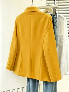Rear view of vibrant mustard yellow slim-fit blazer for professional commuting outfits