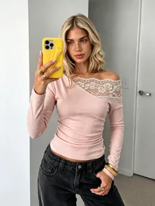 Detailed view of pink French lace off-shoulder long sleeve top with slim fit design