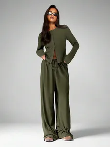Model wearing a women's olive green lounge set showing the wide-leg drape and cardigan fit.
