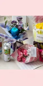 Professional floral spray paint showing color effect on various flower bouquets.