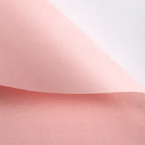 Macro shot of pink waterproof artistic flower wrapping paper with matte texture.