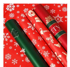 Detailed view of waterproof Christmas wrapping paper rolls with festive snowflake patterns