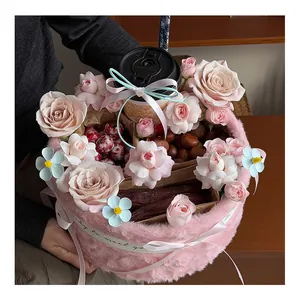 Close-up detail of a pink plush flower bucket gift box with fresh roses and nuts