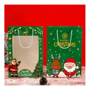 Sachets cadeaux de Noël verts avec fenêtre et motifs de Père Noël et renne de dessin animé