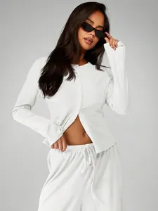 Model wearing white casual long-sleeve cardigan and high-waist drawstring wide-leg pants