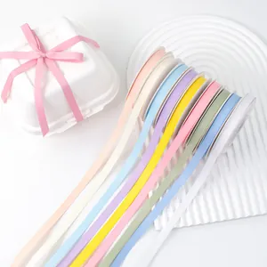 Assorted pastel matte double-sided ribbons for gift wrapping and cake decoration projects