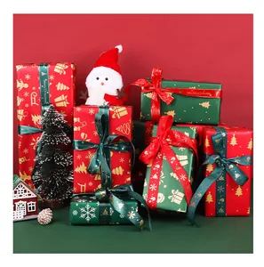 Festive Christmas gift wrapping paper featuring elegant snowflake and gold tree patterns