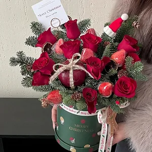 Christmas round floral gift box with red roses, strawberries and apple decoration