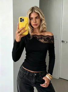 Detailed view of a black French lace patchwork off-the-shoulder long sleeve T-shirt