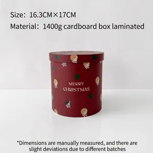 Red round Christmas gift box with Merry Christmas text for flowers and presents
