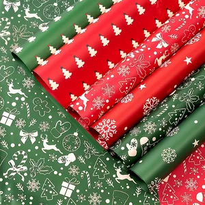 Waterproof Christmas wrapping paper rolls with festive tree and reindeer patterns decor