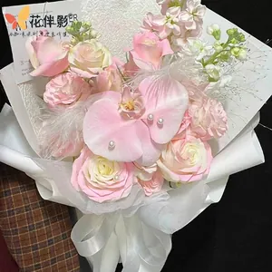 Professional floral color spray dye for elegant pink rose and orchid bouquet.
