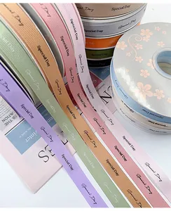 Close-up detail of 'Special Day' printed grosgrain ribbons in various pastel colors