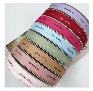 Detailed macro view of colorful grosgrain ribbons with Special Day print for gift wrapping