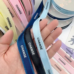Fringed grosgrain ribbons with CHANGE print for floral and gift wrapping projects