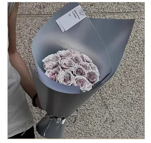 Close-up detail of matte silver pearlescent flower wrapping paper for elegant bouquets
