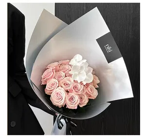 Detail of matte silver hard card wrapping paper used for elegant floral bouquet