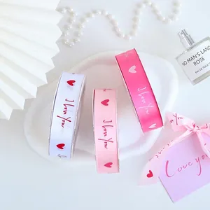 Pink and white heart print satin ribbons with I Love You text for gift wrapping
