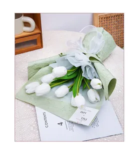 Detail showing the unique stone grain texture of the light green floral wrapping paper