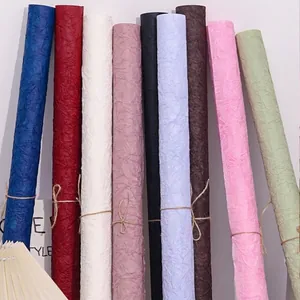 Assorted rolls of hand-rubbed stone texture paper for DIY floral wrapping