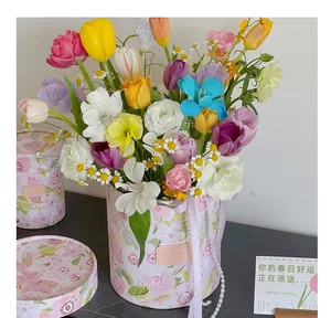 Detailed view of the pink floral print hug bucket set with vibrant spring flowers