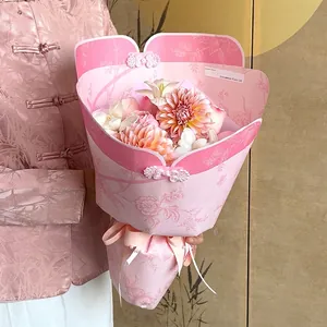 Oriental Qipao style floral wrapping paper in pink with traditional button detail