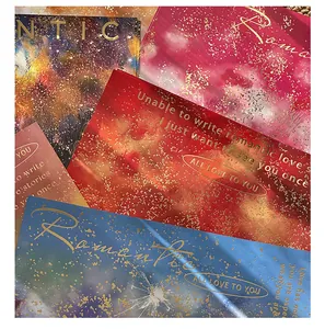 Close-up of colorful fireworks series wrapping paper featuring gold foil romantic text