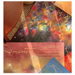Detail of colorful firework wrapping paper with romantic gold foil text for gifting.