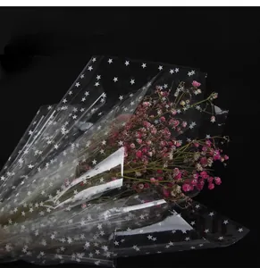 Detailed view of waterproof star pattern cellophane wrapping paper for bouquets.
