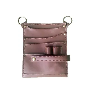 High-quality brown leather florist tool bag with multiple pockets and metal rings for tools
