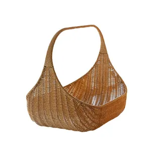 Elegant brown woven rattan fruit basket with tall handle for picnic or wedding gift