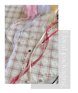 Detailed macro view of elegant pearl woven ribbons for floral gift and craft packaging