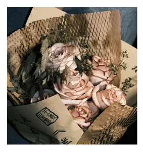 Detailed view of vintage brown honeycomb kraft paper wrapping a rose bouquet for DIY floral art