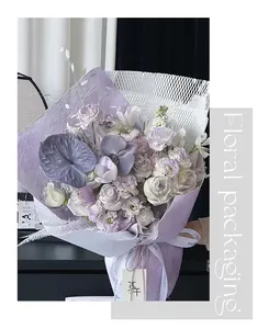 Detailed view of lavender textured and white honeycomb floral packaging paper