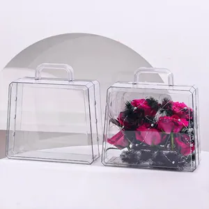 Detailed view of clear acrylic hand-held gift boxes featuring an elegant flower arrangement