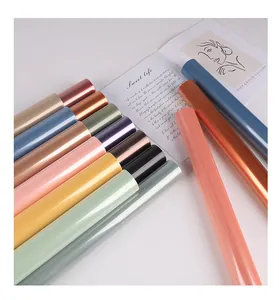 Detail of multiple colorful translucent OPP jelly film rolls for flower wrapping.