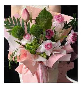Close-up of pink oriental floral wrapping paper featuring traditional cloud patterns