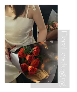 Elegant matte floral wrapping paper used for a romantic and premium red rose bouquet