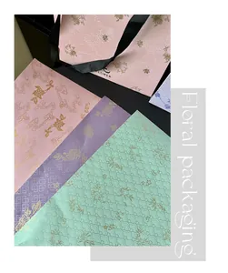 Detailed view of oriental floral packaging paper with gold patterns for bouquets