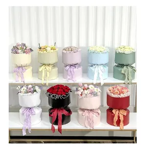 Vista detallada de cajas de embalaje para flores de estilo coreano en varios colores con lazos
