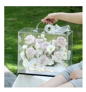 Detailed view of a luxury clear acrylic flower gift box with roses and elegant pearls