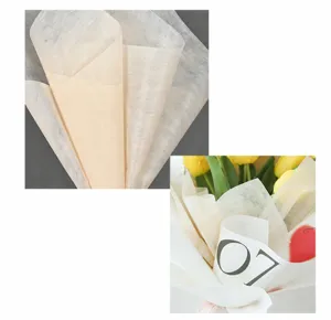 Close-up detail of cream milk cotton flower wrapping paper showing texture and usage.