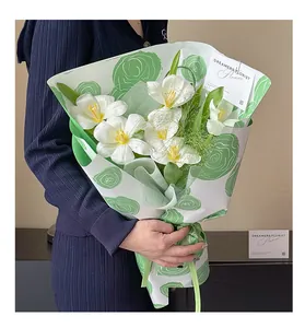 Premium green rose pattern floral wrapping paper shown on a white tulip bouquet