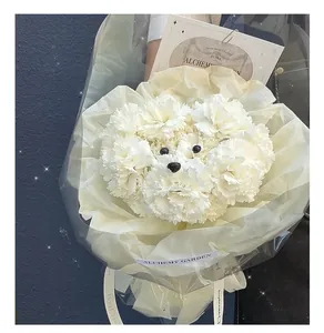 Close-up of a puppy-shaped bouquet made from white carnations with cute eye stickers