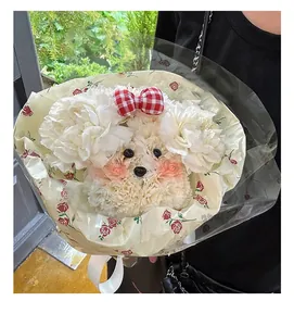 Close-up of a DIY carnation bouquet shaped like a cute dog with a red bow
