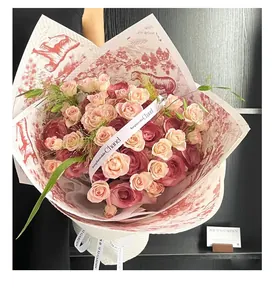 Close-up of Toile de Jouy style red flower wrapping paper for elegant bouquets