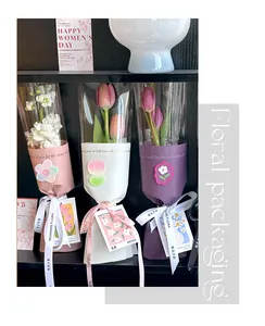 Close-up of elegant transparent floral packaging bags with ribbons for small bouquets