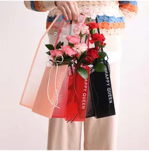 Close-up detail of crystal clear single flower carrier bags with Happy Queen English print