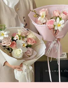 Detail view of Hepburn style flower wrapping paper with pearl trim for elegant bouquets