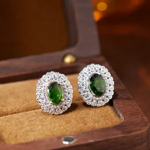 Detailed macro view of vintage S925 silver green chrome diopside halo stud earrings